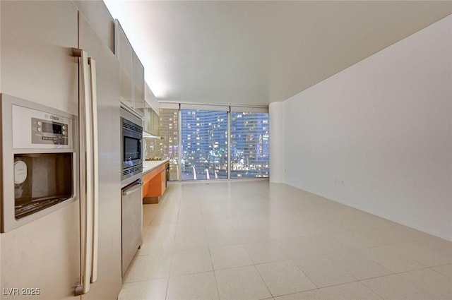 3726 S Las Vegas Blvd Unit 1003, Las Vegas, NV 89158 - kitchen with fridge with ice dispenser, stainless steel microwave, and light countertops