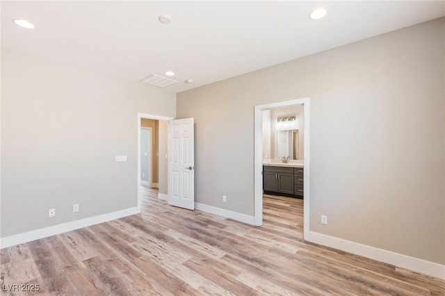 790 Lone Pine Rd, Pahrump, NV 89048 - unfurnished bedroom featuring recessed lighting, light wood-type flooring, and ensuite bath