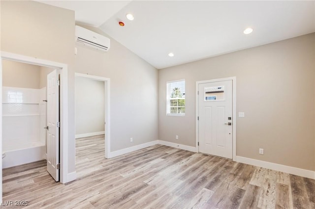 790 Lone Pine Rd, Pahrump, NV 89048 - entrance foyer featuring a wall mounted air conditioner, light wood finished floors, lofted ceiling, and recessed lighting