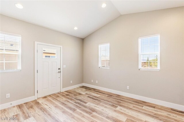 790 Lone Pine Rd, Pahrump, NV 89048 - foyer featuring healthy amount of natural light, vaulted ceiling, light wood finished floors, and recessed lighting