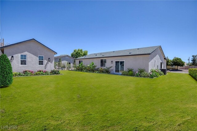 790 Lone Pine Rd, Pahrump, NV 89048 - rear view of property with a lawn and stucco siding