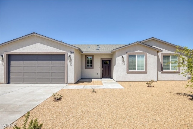 790 Lone Pine Rd, Pahrump, NV 89048 - ranch-style home with a garage, stucco siding, and driveway
