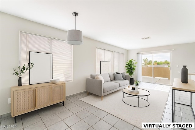 1400 Jamielinn Ln Unit 104, Las Vegas, NV 89110 - living room featuring light tile patterned floors and baseboards