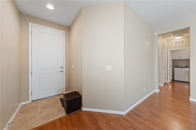 10664 Mount Jefferson Ave, Las Vegas, NV 89166 - hall featuring washer / dryer, baseboards, and wood finished floors