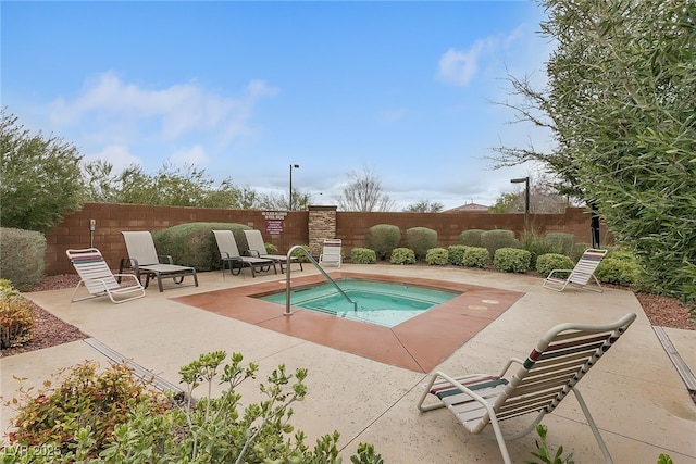 10664 Mount Jefferson Ave, Las Vegas, NV 89166 - view of pool with a community hot tub, a fenced backyard, and a patio area