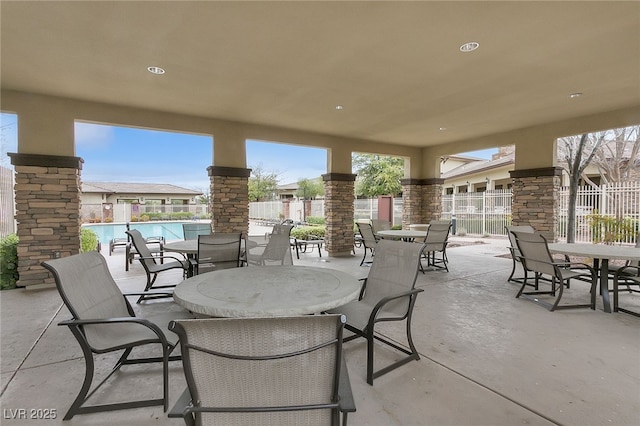 10664 Mount Jefferson Ave, Las Vegas, NV 89166 - view of patio / terrace with outdoor dining area and a community pool