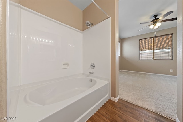 10664 Mount Jefferson Ave, Las Vegas, NV 89166 - full bathroom featuring baseboards, washtub / shower combination, ceiling fan, and wood finished floors