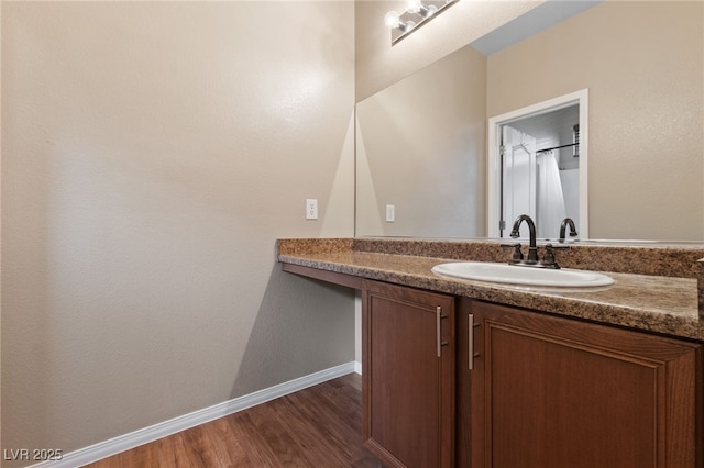 10664 Mount Jefferson Ave, Las Vegas, NV 89166 - bathroom featuring vanity, wood finished floors, and baseboards