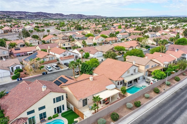 1552 Livingston Dr, Henderson, NV 89012 - aerial perspective of suburban area featuring a pool and mountains