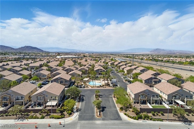 birds eye view of property featuring a mountain view and a residential view