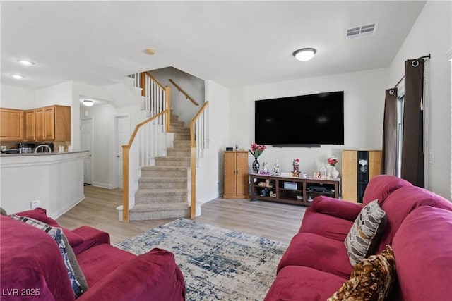 1069 Thrill Ct Unit 102, Henderson, NV 89002 - living area with stairway and light wood-style floors