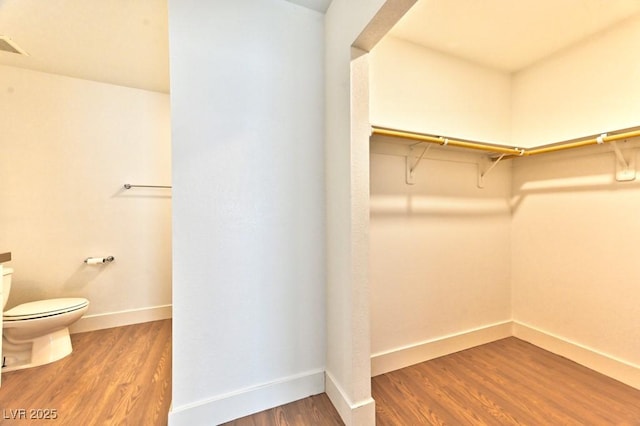 spacious closet with wood finished floors