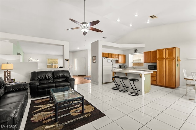 5224 Dana Springs Way, Las Vegas, NV 89130 - living area featuring visible vents, recessed lighting, a ceiling fan, high vaulted ceiling, and light tile patterned floors