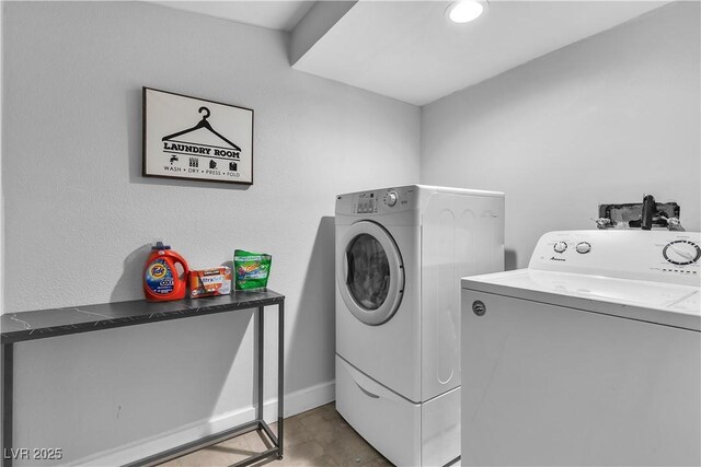 5208 Overland Ave, Las Vegas, NV 89107 - laundry room featuring separate washer and dryer and baseboards