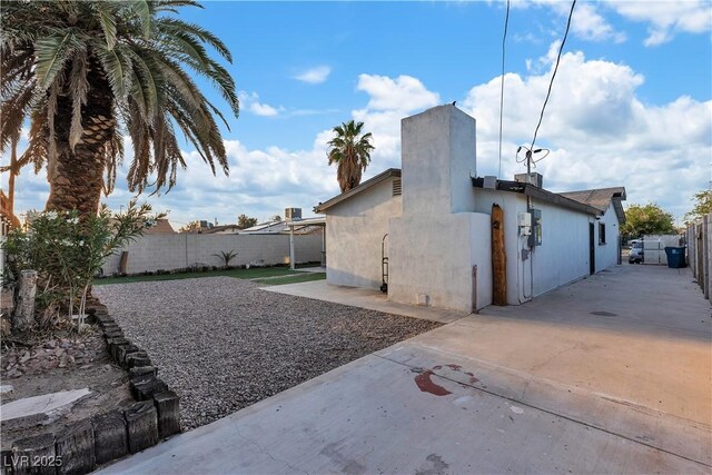 5208 Overland Ave, Las Vegas, NV 89107 - view of home's exterior with a fenced backyard and a patio area