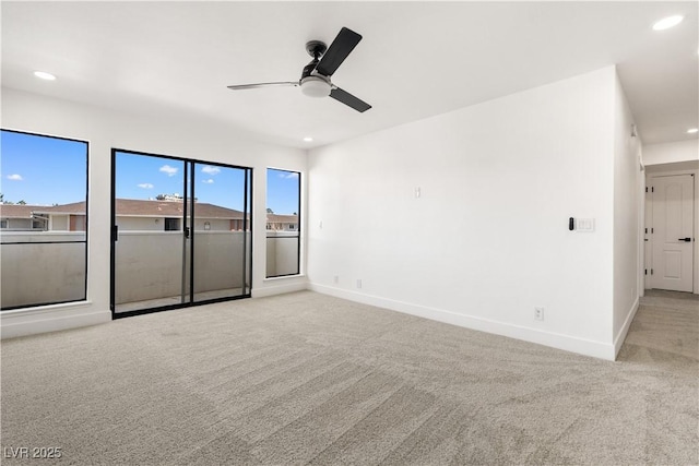 carpeted spare room featuring a ceiling fan, baseboards, and recessed lighting