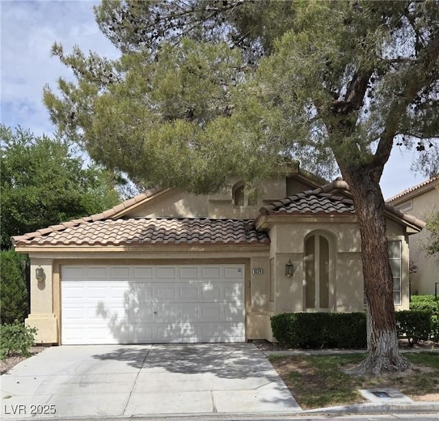 9324 Pitching Wedge Dr, Las Vegas, NV 89134 - view of front facade with an attached garage, stucco siding, concrete driveway, and a tiled roof