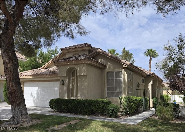9324 Pitching Wedge Dr, Las Vegas, NV 89134 - mediterranean / spanish-style house with a tile roof, a garage, stucco siding, and fence