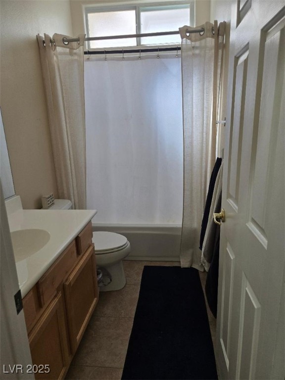 9324 Pitching Wedge Dr, Las Vegas, NV 89134 - full bathroom with tile patterned floors, shower / tub combo with curtain, toilet, and vanity