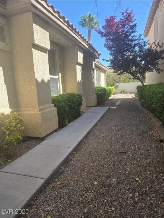 9324 Pitching Wedge Dr, Las Vegas, NV 89134 - view of property exterior featuring a tile roof and stucco siding