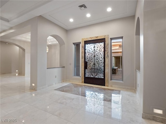 1665 Liege Dr, Henderson, NV 89012 - foyer entrance with baseboards, visible vents, arched walkways, and marble finish floor