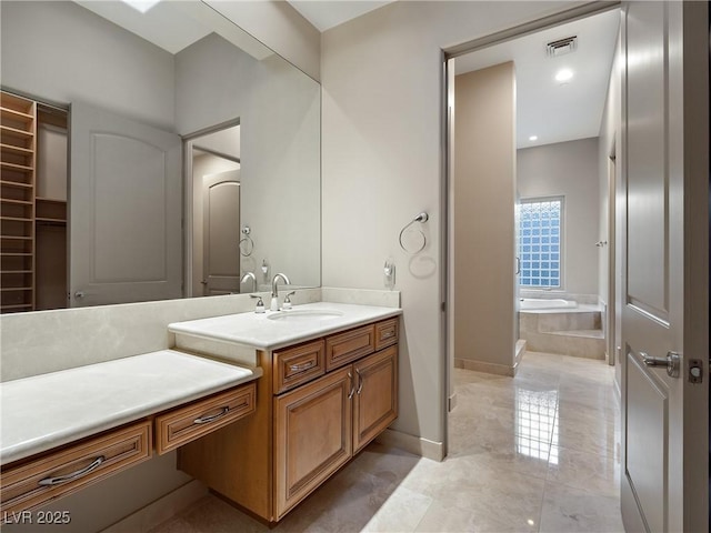 1665 Liege Dr, Henderson, NV 89012 - full bathroom with a bath, vanity, marble finish floor, baseboards, and visible vents