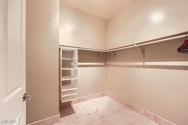 2455 W Serene Ave Unit 923, Las Vegas, NV 89123 - walk in closet featuring marble finish floors