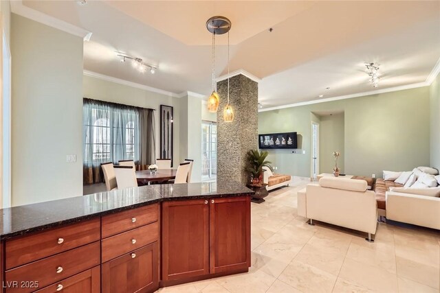 2455 W Serene Ave Unit 923, Las Vegas, NV 89123 - kitchen featuring open floor plan, crown molding, hanging light fixtures, and dark stone counters