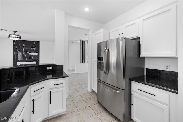 kitchen with white cabinets, recessed lighting, light tile patterned floors, and stainless steel fridge with ice dispenser
