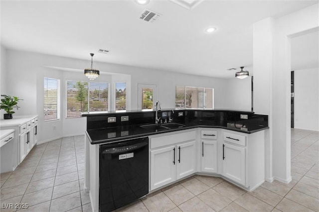 kitchen featuring dishwasher, visible vents, light tile patterned floors, and a sink