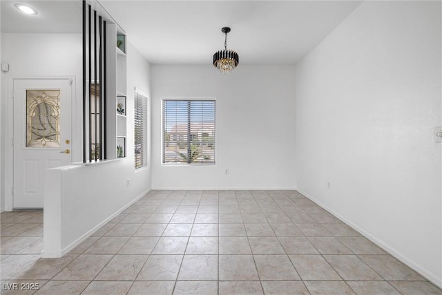 unfurnished dining area featuring light tile patterned flooring, baseboards, a notable chandelier, and recessed lighting