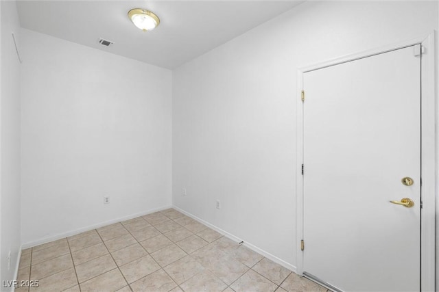 empty room featuring visible vents and baseboards