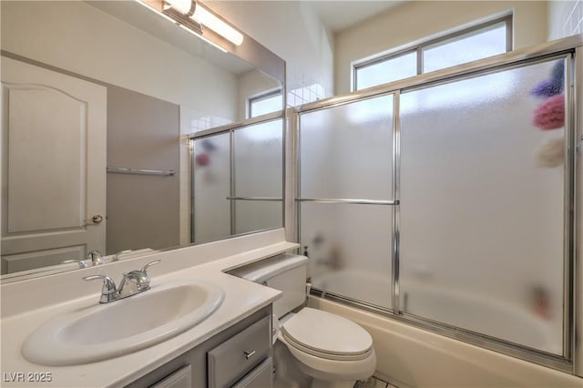 8942 Galena Crossing St, Las Vegas, NV 89123 - bathroom with vanity, enclosed tub / shower combo, and toilet