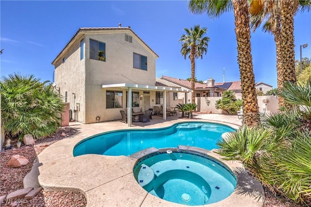 8942 Galena Crossing St, Las Vegas, NV 89123 - view of pool with a pool with connected hot tub, a patio, and a fenced backyard
