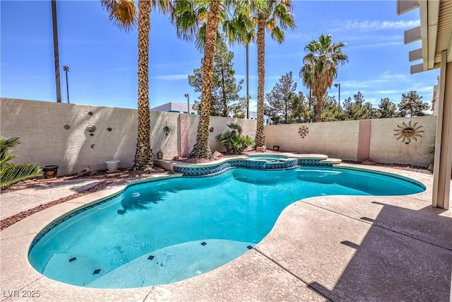 8942 Galena Crossing St, Las Vegas, NV 89123 - view of swimming pool featuring a fenced backyard, a patio, and a pool with connected hot tub