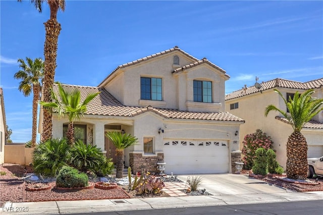 8942 Galena Crossing St, Las Vegas, NV 89123 - mediterranean / spanish home featuring driveway, stucco siding, a tile roof, a garage, and stone siding