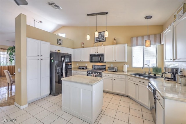 8942 Galena Crossing St, Las Vegas, NV 89123 - kitchen with black appliances, a sink, healthy amount of natural light, white cabinets, and high vaulted ceiling
