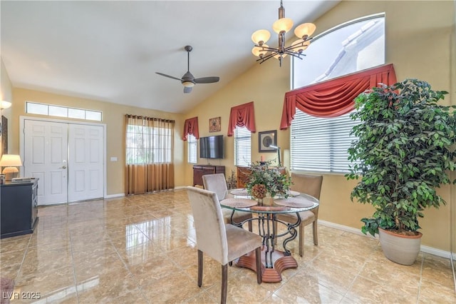 8942 Galena Crossing St, Las Vegas, NV 89123 - dining area featuring baseboards, a chandelier, high vaulted ceiling, and a ceiling fan