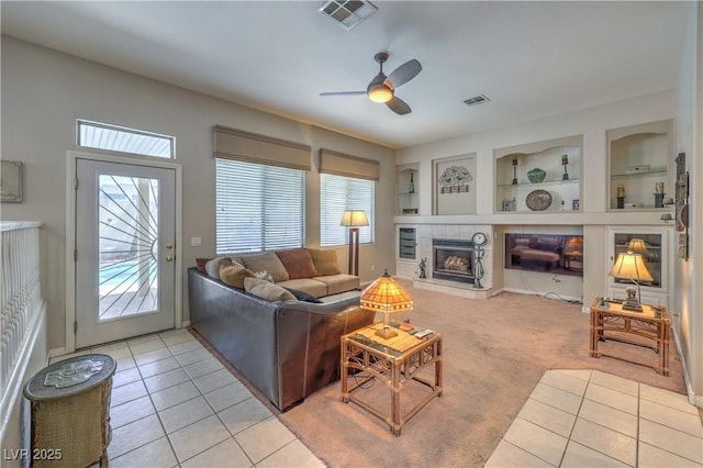 8942 Galena Crossing St, Las Vegas, NV 89123 - living area with plenty of natural light, light tile patterned floors, ceiling fan, and built in features