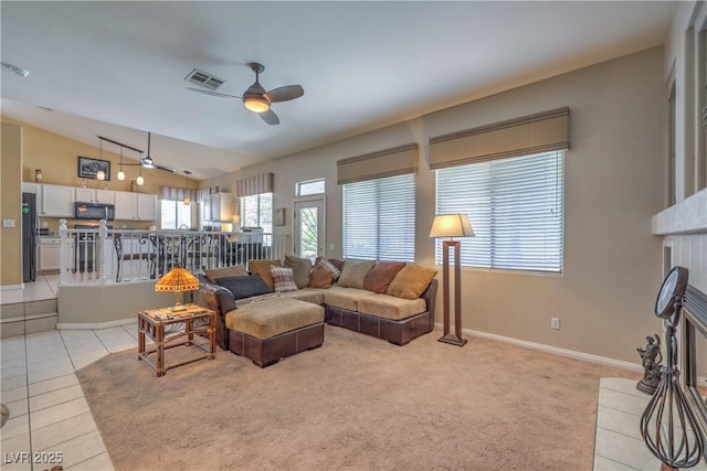 8942 Galena Crossing St, Las Vegas, NV 89123 - living area featuring ceiling fan, vaulted ceiling, light tile patterned flooring, and baseboards