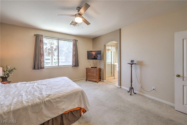 8942 Galena Crossing St, Las Vegas, NV 89123 - bedroom with arched walkways, carpet floors, baseboards, ensuite bathroom, and ceiling fan