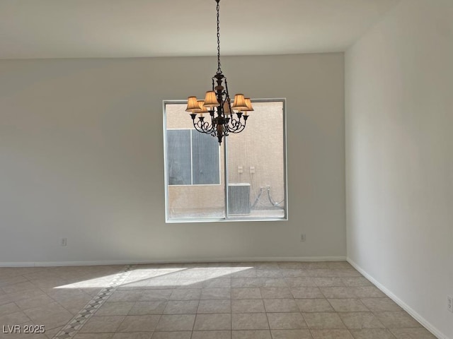 825 Happy Sparrow Ave, Henderson, NV 89052 - unfurnished dining area featuring tile patterned floors, baseboards, a notable chandelier, and a healthy amount of sunlight