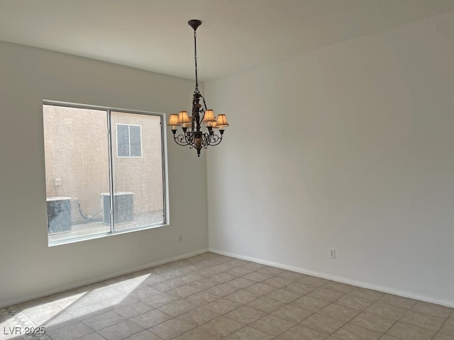 825 Happy Sparrow Ave, Henderson, NV 89052 - unfurnished room featuring baseboards and a notable chandelier