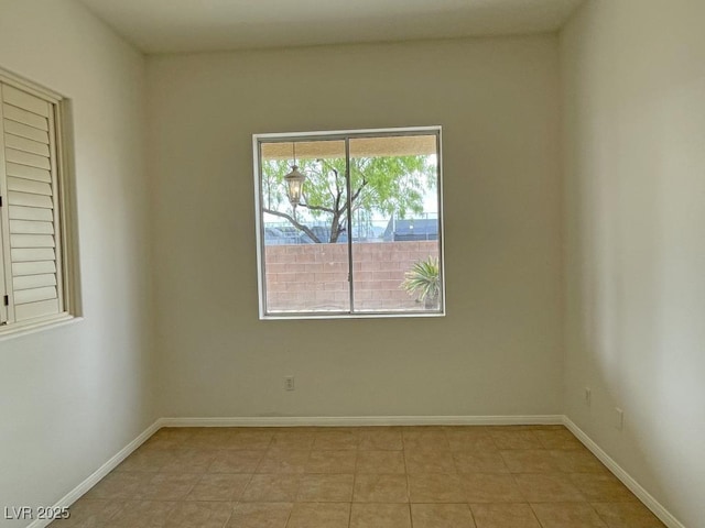 825 Happy Sparrow Ave, Henderson, NV 89052 - empty room with baseboards and light tile patterned floors