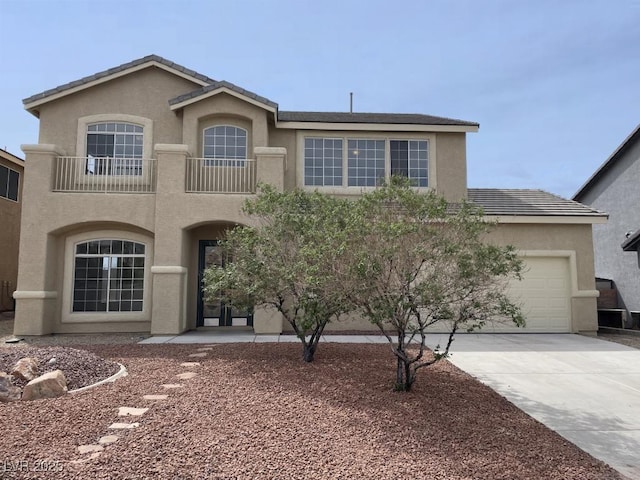 825 Happy Sparrow Ave, Henderson, NV 89052 - view of front of property featuring concrete driveway, an attached garage, a tiled roof, and stucco siding