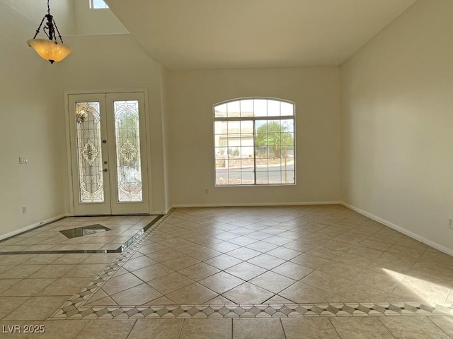 825 Happy Sparrow Ave, Henderson, NV 89052 - entryway featuring lofted ceiling, baseboards, and french doors