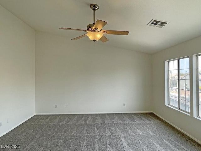 825 Happy Sparrow Ave, Henderson, NV 89052 - unfurnished room featuring baseboards, dark colored carpet, visible vents, and ceiling fan