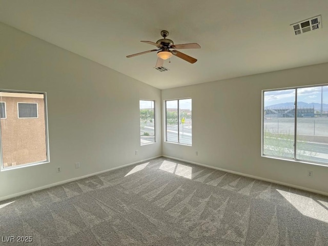 825 Happy Sparrow Ave, Henderson, NV 89052 - empty room with ceiling fan, vaulted ceiling, carpet floors, and visible vents
