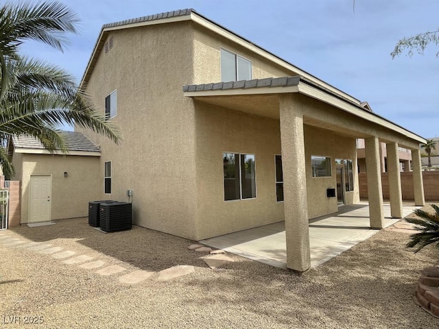 825 Happy Sparrow Ave, Henderson, NV 89052 - rear view of house featuring a patio area, central AC unit, and stucco siding