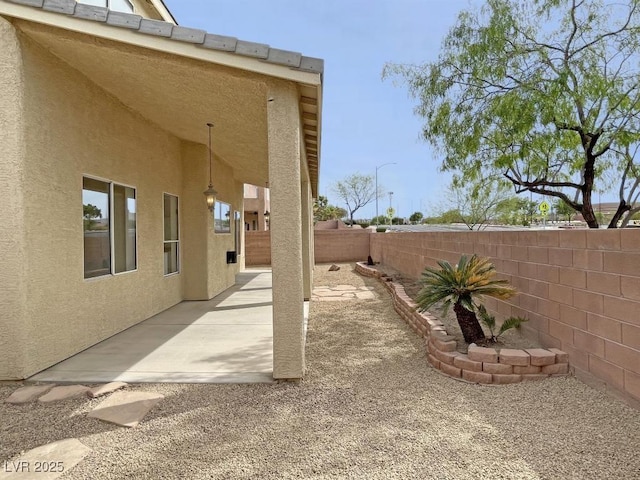 825 Happy Sparrow Ave, Henderson, NV 89052 - view of yard with a fenced backyard and a patio